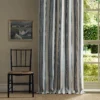 blue striped curtain with window and chair