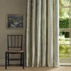green striped curtain with window and chair