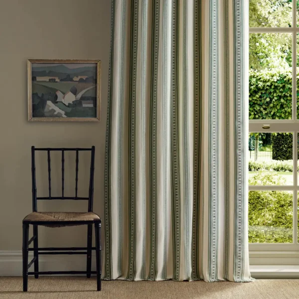 green striped curtain with window and chair