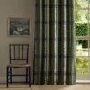 green striped curtain with window and chair