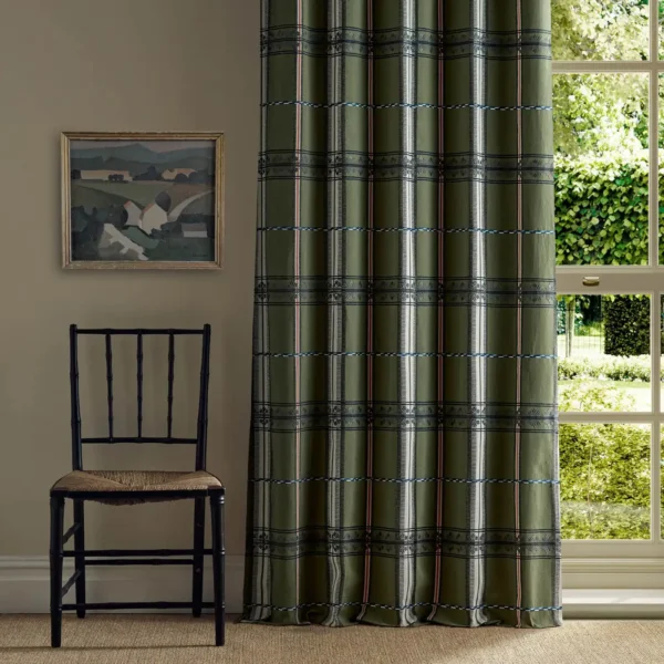 green striped curtain with window and chair