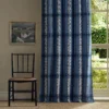 blue striped curtain with window and chair