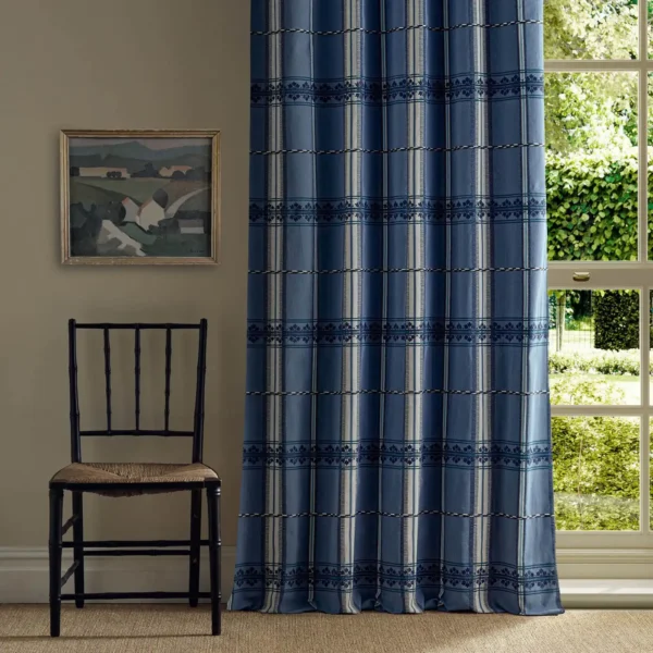 blue striped curtain with window and chair