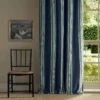 blue striped curtain with window and chair