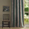 green striped curtain with window and chair
