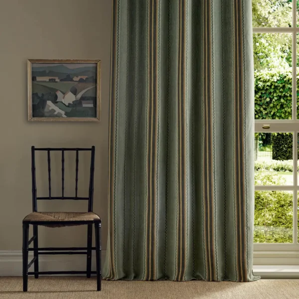 green striped curtain with window and chair