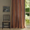 orange striped curtain with window and chair