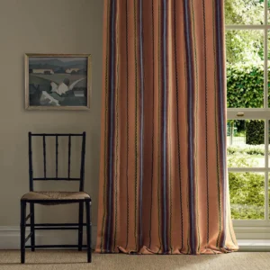 orange striped curtain with window and chair
