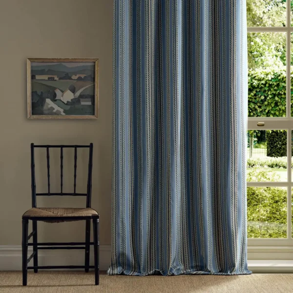 blue striped curtain with window and chair