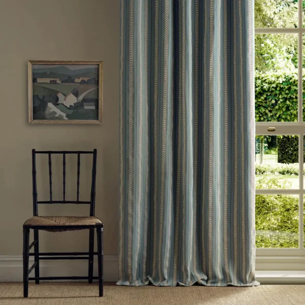 blue striped curtain with window and chair