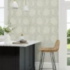 blue botanical wallpaper and wall with chair and dining table