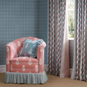 green striped curtain with armchair and cushion