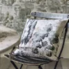 blue botanical cushion with side table and chair