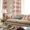 red botanical curtain with sofa and armchair