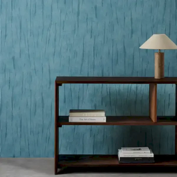 blue contemporary wallpaper and wall with bookshelf and vases