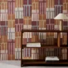 red geometric wallpaper and wall with bookshelf and vases