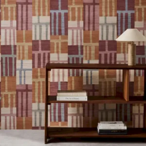 red geometric wallpaper and wall with bookshelf and vases