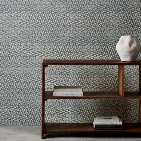 Loam Wallpaper - Kyanite by blue spotted wallpaper and wall with bookshelf and vases
