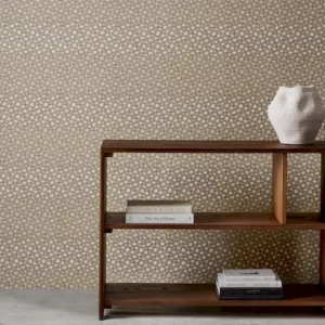 brown spotted wallpaper and wall with bookshelf and vases