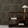 brown geometric wallpaper and wall with bookshelf and vases
