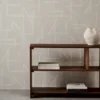 black-grey geometric wallpaper and wall with bookshelf and vases