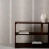 black-grey striped wallpaper and wall with bookshelf and vases