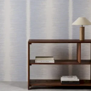 blue striped wallpaper and wall with bookshelf and vases