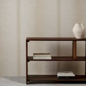 neutral striped wallpaper and wall with bookshelf and vases