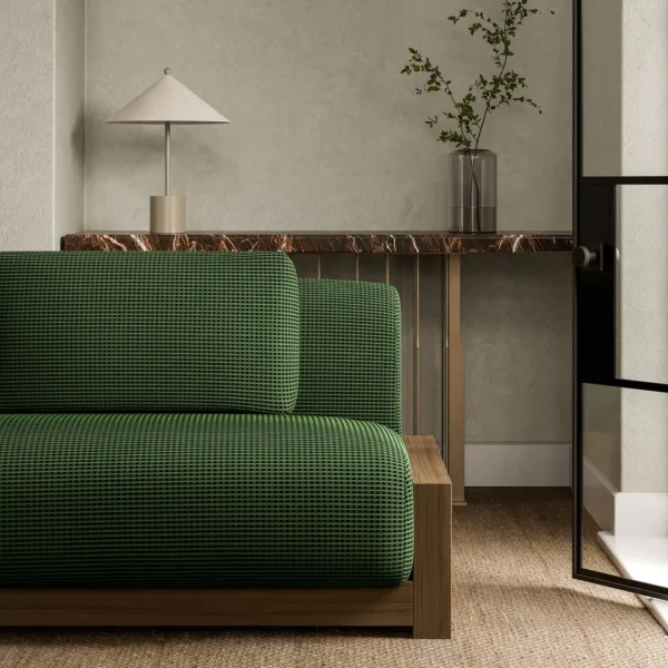 Ore Fabric - Jade by green plain sofa with side table and vases