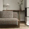 pink misc sofa with side table and vases