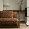 orange misc sofa with side table and vases