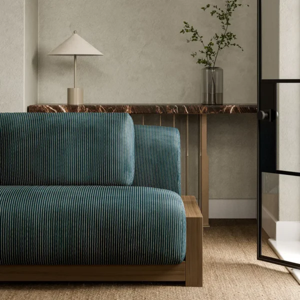 Karst Fabric - Midnight by blue striped sofa with side table and vases