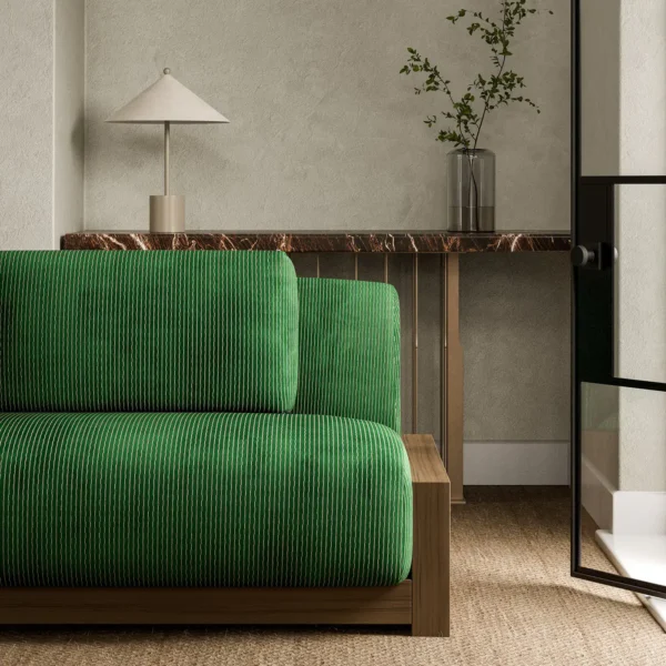 Karst Fabric - Emerald by green striped sofa with side table and vases