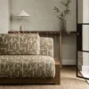 brown geometric sofa with side table and vases