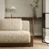 neutral geometric sofa with side table and vases