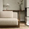 white geometric sofa with side table and vases