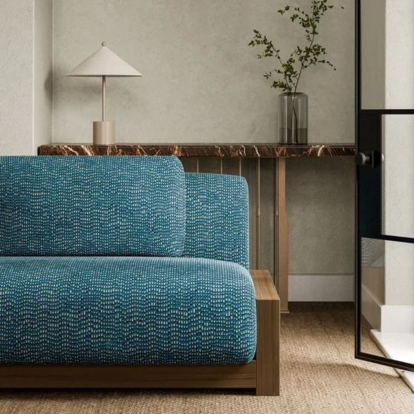 Chert Fabric - Sapphire by blue plain sofa with side table and vases