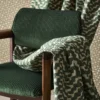 green misc curtain with chair and wall