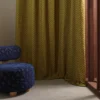 yellow misc curtain with armchair and window