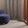 blue misc curtain with armchair and window