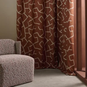 red misc curtain with armchair and window