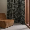 black-grey contemporary curtain with armchair and window