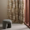 brown geometric curtain with armchair and window