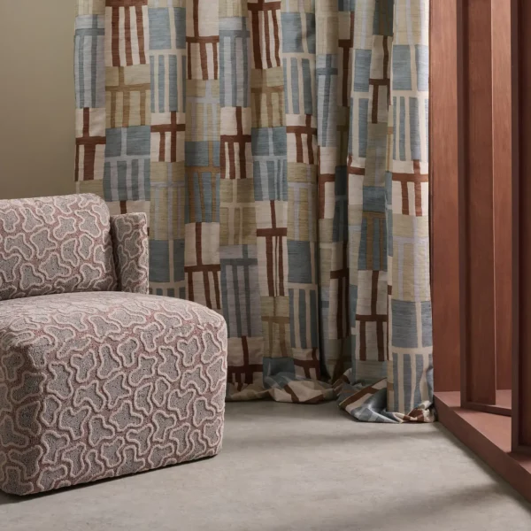 Monolith Fabric - Jasper / Zircon by red geometric curtain with armchair and window