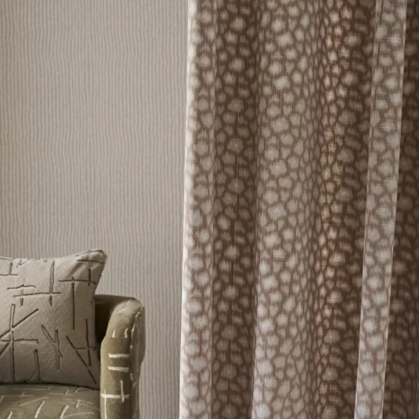 Loam Fabric - Rust by red spotted curtain with wall and cushion
