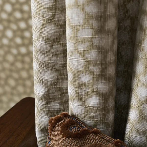 Loam Fabric - Olivine by green spotted curtain with wall and cushion
