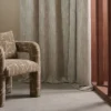 green misc curtain with armchair and window