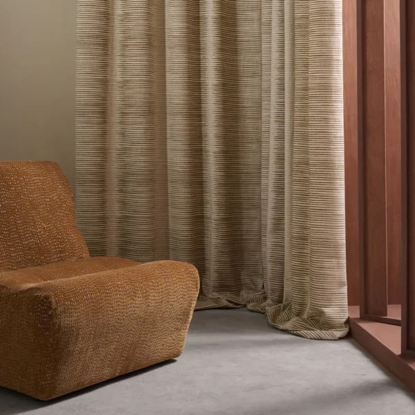 Chaco Fabric - Sand by brown striped curtain with armchair and window