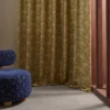 yellow geometric curtain with armchair and window
