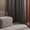 blue misc curtain with armchair and window